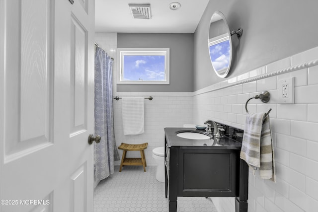 813 Tiller Dr, Forked River, NJ 08731 - full bath with vanity, tile walls, a wainscoted wall, and tile patterned floors