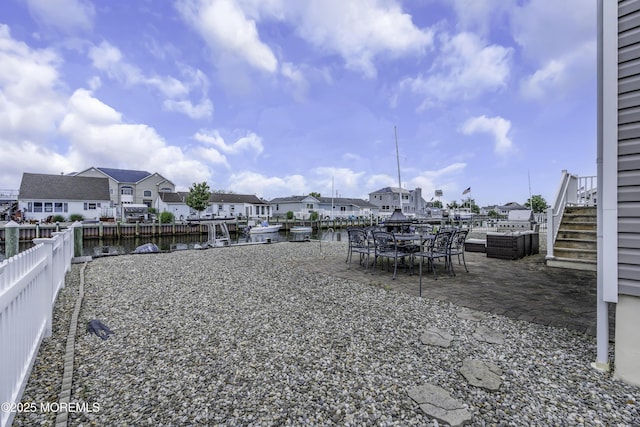 813 Tiller Dr, Forked River, NJ 08731 - fenced backyard featuring a water view, a patio area, a residential view, and stairway