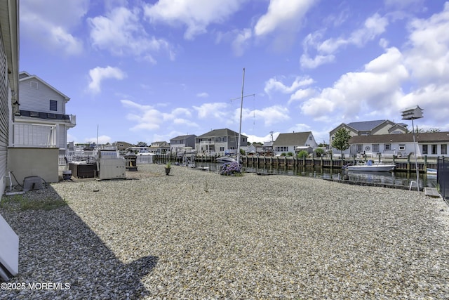 813 Tiller Dr, Forked River, NJ 08731 - view of yard with a water view, a residential view, and a boat dock