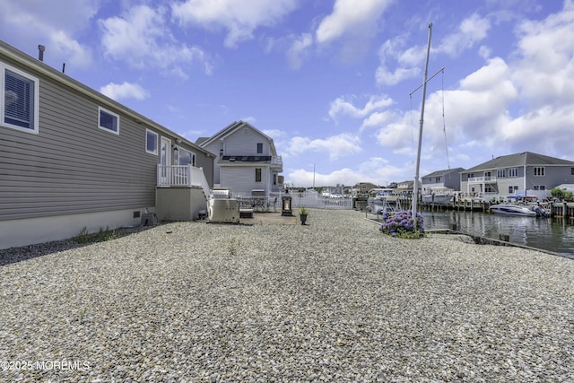 813 Tiller Dr, Forked River, NJ 08731 - view of yard with a water view, a residential view, and a patio area