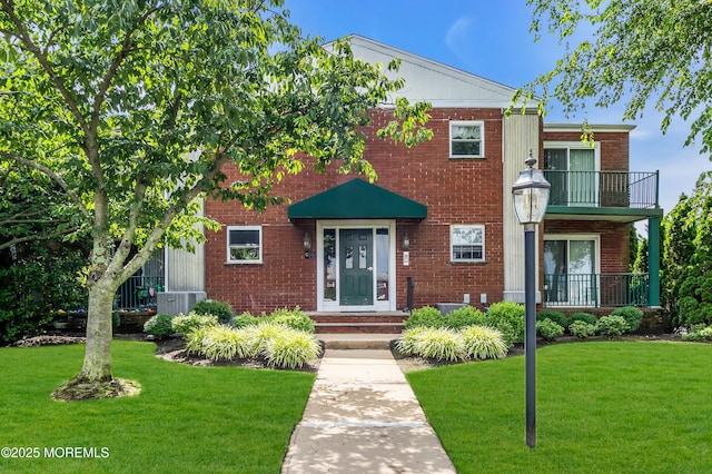 65 Cedar Ave Unit C16, Long Branch, NJ 07740 - view of front of home with a front yard, brick siding, and a balcony