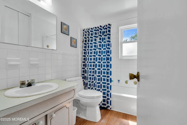 65 Cedar Ave Unit C16, Long Branch, NJ 07740 - bathroom with tile walls, vanity, shower / tub combo, and wood finished floors