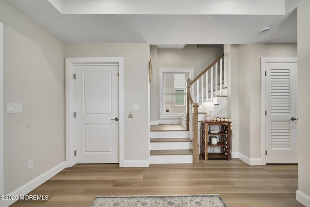 209 E 20th St, Long Beach Twp, NJ 08008 - staircase with baseboards and wood finished floors