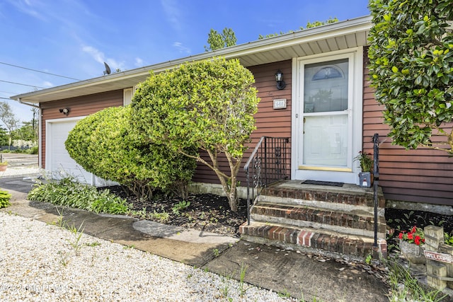 648 E Bayview Ave, Ocean Gate, NJ 08740 - doorway to property featuring a garage