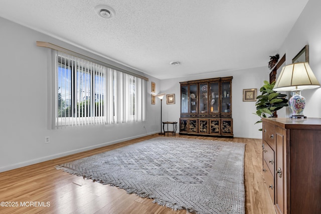 648 E Bayview Ave, Ocean Gate, NJ 08740 - living room featuring light wood-style floors and a textured ceiling