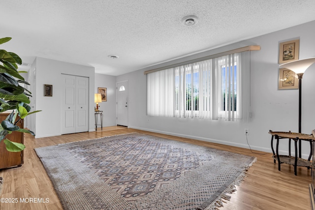 648 E Bayview Ave, Ocean Gate, NJ 08740 - entryway featuring a textured ceiling and light wood-style flooring
