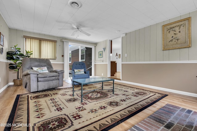648 E Bayview Ave, Ocean Gate, NJ 08740 - living room with wood finished floors, ceiling fan, and wooden walls