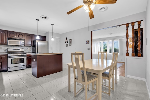648 E Bayview Ave, Ocean Gate, NJ 08740 - dining area with a ceiling fan and light tile patterned flooring