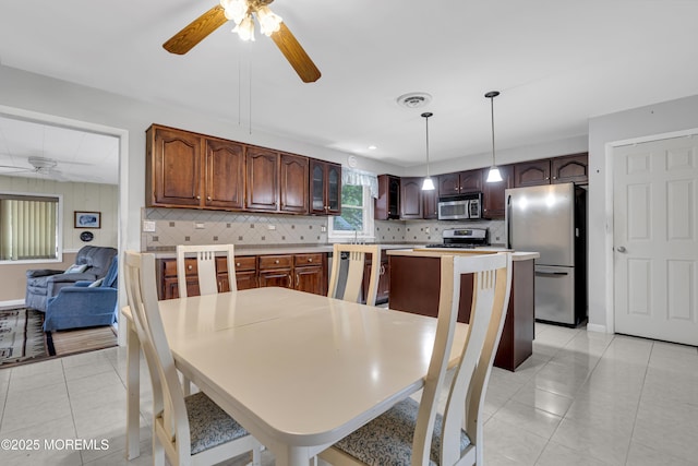 648 E Bayview Ave, Ocean Gate, NJ 08740 - dining area featuring a ceiling fan and light tile patterned flooring