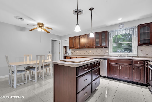 648 E Bayview Ave, Ocean Gate, NJ 08740 - kitchen with dishwasher, light countertops, ceiling fan, backsplash, and a kitchen island