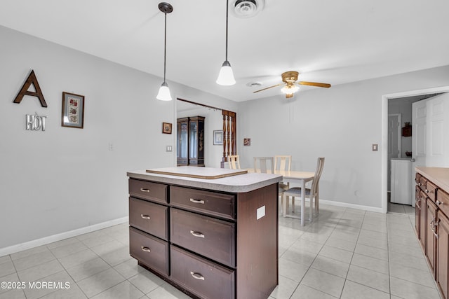 648 E Bayview Ave, Ocean Gate, NJ 08740 - kitchen featuring light tile patterned floors, ceiling fan, and light countertops