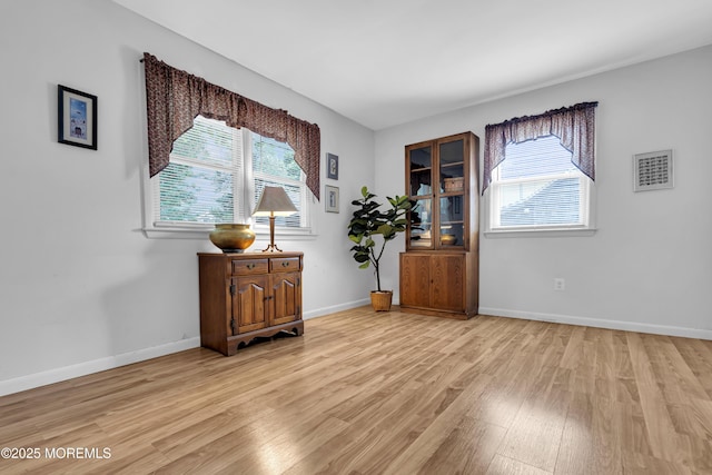 648 E Bayview Ave, Ocean Gate, NJ 08740 - empty room with light wood-style flooring and baseboards