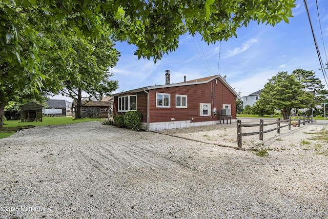 648 E Bayview Ave, Ocean Gate, NJ 08740 - view of side of property with gravel driveway