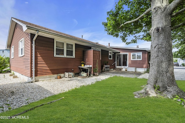 648 E Bayview Ave, Ocean Gate, NJ 08740 - back of property with a yard and entry steps