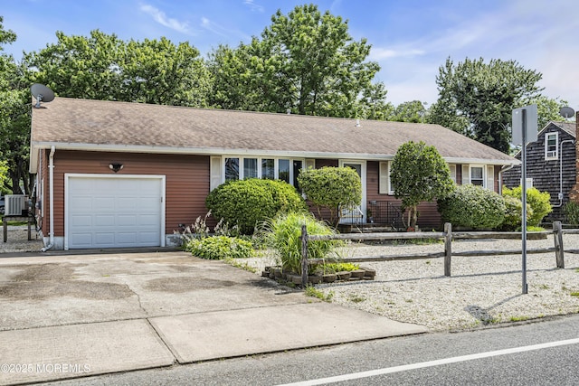 648 E Bayview Ave, Ocean Gate, NJ 08740 - single story home featuring a garage, concrete driveway, and roof with shingles