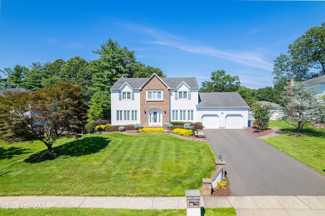 18 Rowena Rd, Manalapan, NJ 07726 - colonial house with an attached garage, a front lawn, and driveway