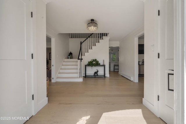 18 Rowena Rd, Manalapan, NJ 07726 - entryway with stairs, light wood finished floors, and a chandelier