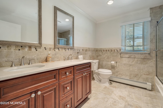 18 Rowena Rd, Manalapan, NJ 07726 - bathroom with a baseboard heating unit, crown molding, double vanity, tile walls, and wainscoting