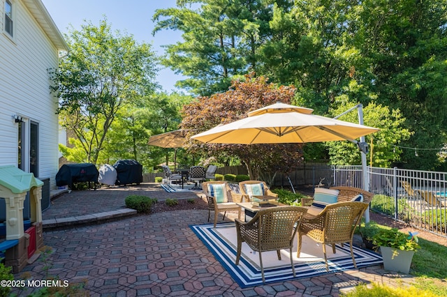 18 Rowena Rd, Manalapan, NJ 07726 - fenced backyard featuring a patio, a grill, and outdoor dining space