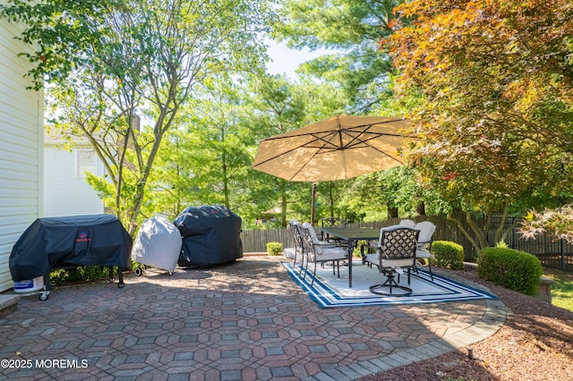 18 Rowena Rd, Manalapan, NJ 07726 - fenced backyard featuring a grill, a patio area, and outdoor dining space