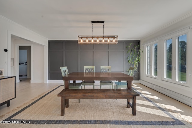 18 Rowena Rd, Manalapan, NJ 07726 - dining room with a decorative wall, ornamental molding, and light wood-style flooring