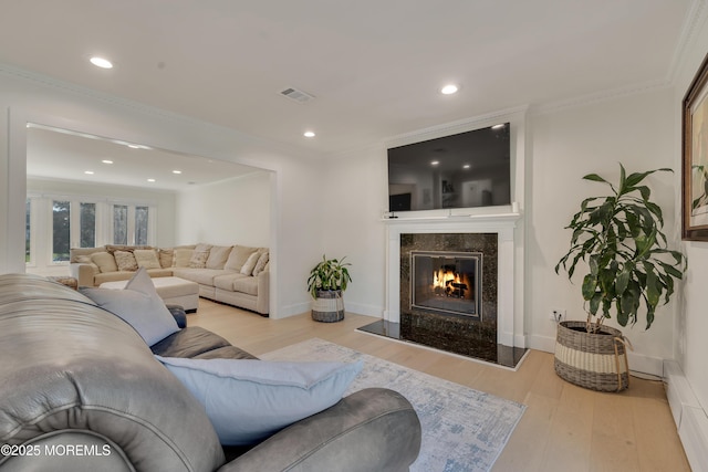 18 Rowena Rd, Manalapan, NJ 07726 - living room featuring wood finished floors, a premium fireplace, recessed lighting, and crown molding