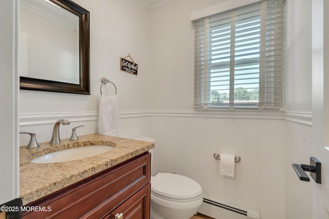 18 Rowena Rd, Manalapan, NJ 07726 - bathroom featuring baseboard heating, vanity, wainscoting, a decorative wall, and crown molding