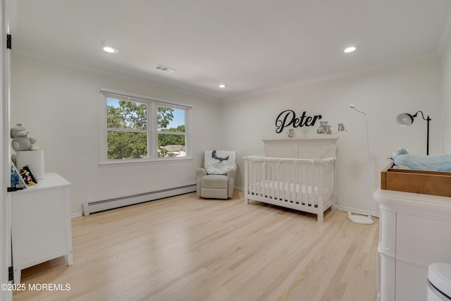 18 Rowena Rd, Manalapan, NJ 07726 - bedroom with baseboard heating, light wood-style floors, recessed lighting, a crib, and ornamental molding