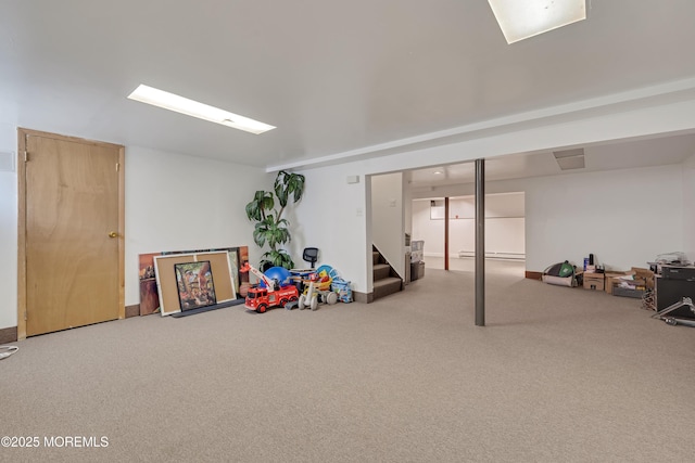 18 Rowena Rd, Manalapan, NJ 07726 - finished below grade area with carpet floors, stairway, and a baseboard heating unit