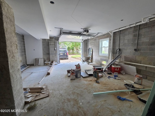359 Lorillard Ave, Union Beach, NJ 07735 - garage featuring a garage door opener and concrete block wall