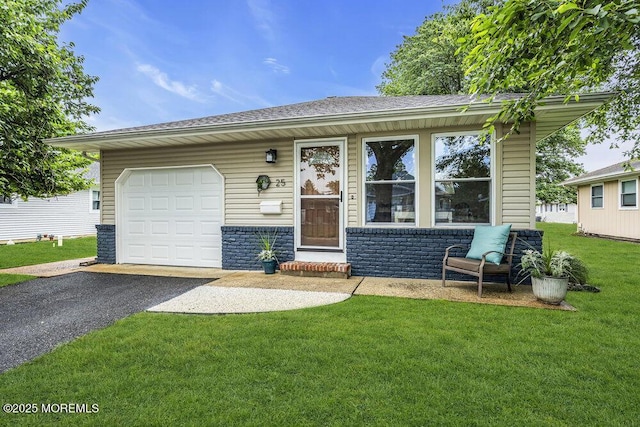 25 Montserrat St, Toms River, NJ 08757 - view of front facade with asphalt driveway, an attached garage, a front lawn, roof with shingles, and brick siding