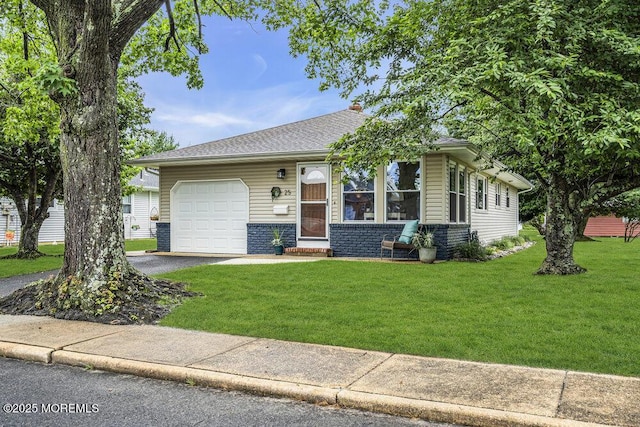 25 Montserrat St, Toms River, NJ 08757 - view of front of house featuring a garage, a front lawn, asphalt driveway, and roof with shingles