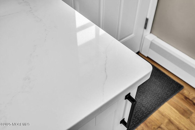 25 Montserrat St, Toms River, NJ 08757 - detailed view of a baseboard radiator and wood finished floors