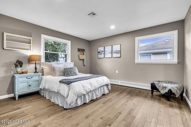 25 Montserrat St, Toms River, NJ 08757 - bedroom with light wood finished floors and a baseboard radiator