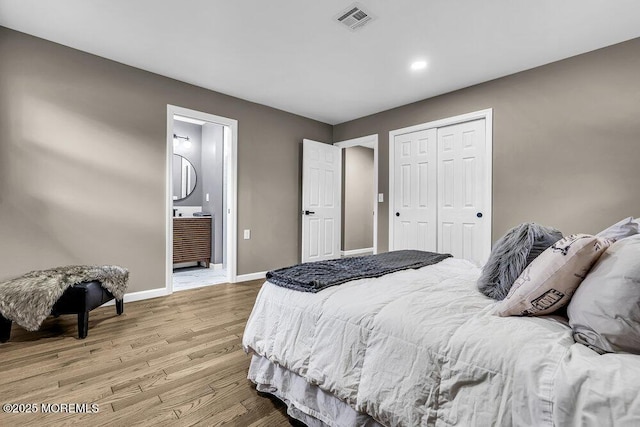 25 Montserrat St, Toms River, NJ 08757 - bedroom with light wood finished floors, a closet, recessed lighting, and ensuite bath