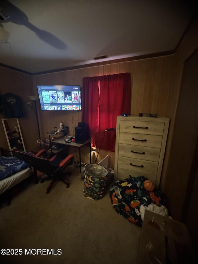 9 Winnebago Trl, Browns Mills, NJ 08015 - carpeted bedroom with wooden walls and a ceiling fan
