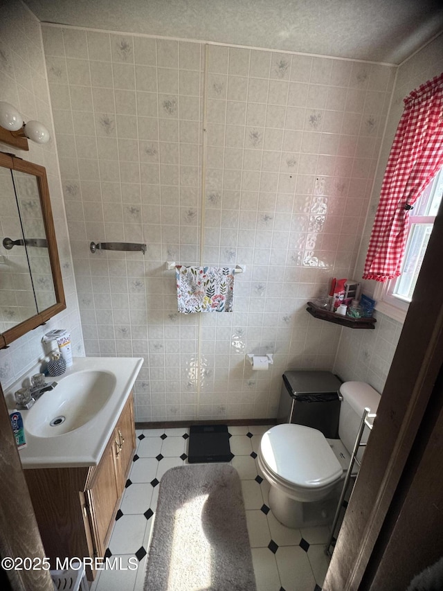 9 Winnebago Trl, Browns Mills, NJ 08015 - bathroom with vanity, tile patterned floors, and tile walls