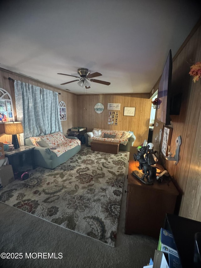 9 Winnebago Trl, Browns Mills, NJ 08015 - carpeted living room featuring wooden walls and a ceiling fan