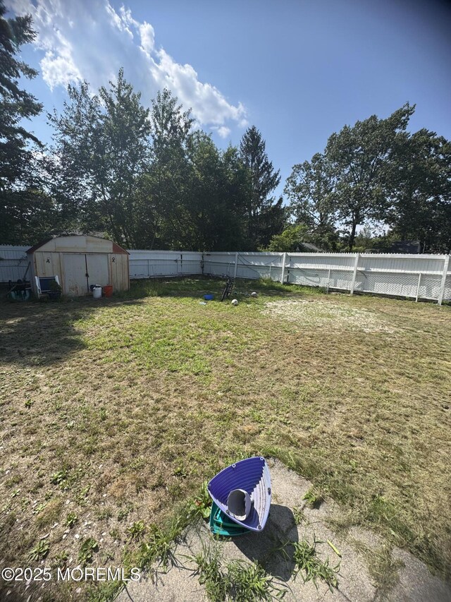 9 Winnebago Trl, Browns Mills, NJ 08015 - fenced backyard featuring a storage unit