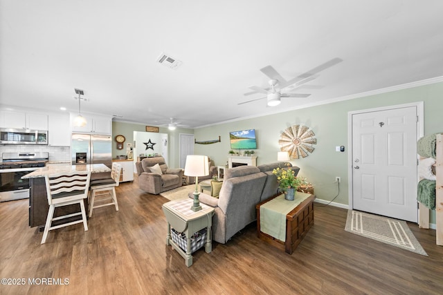 14 Campion Ct, Brick, NJ 08724 - living area featuring a ceiling fan, wood finished floors, crown molding, and a fireplace