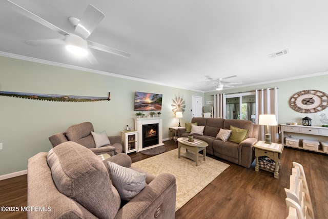 14 Campion Ct, Brick, NJ 08724 - living area with ceiling fan, dark wood-style floors, ornamental molding, and a lit fireplace