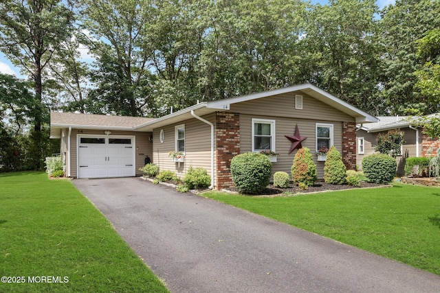 14 Campion Ct, Brick, NJ 08724 - ranch-style house featuring a garage, driveway, and a front lawn