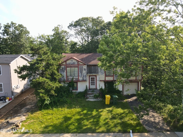 1221 Medina Rd, Lakewood, NJ 08701 - view of front of property featuring a garage and concrete driveway