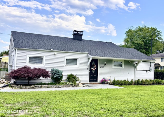 2905 Appleby Dr, Ocean Twp, NJ 07712 - view of front of house featuring a front yard, a shingled roof, and a chimney