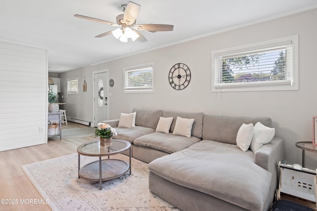 2905 Appleby Dr, Ocean Twp, NJ 07712 - living room with light wood-type flooring, baseboard heating, ceiling fan, and crown molding