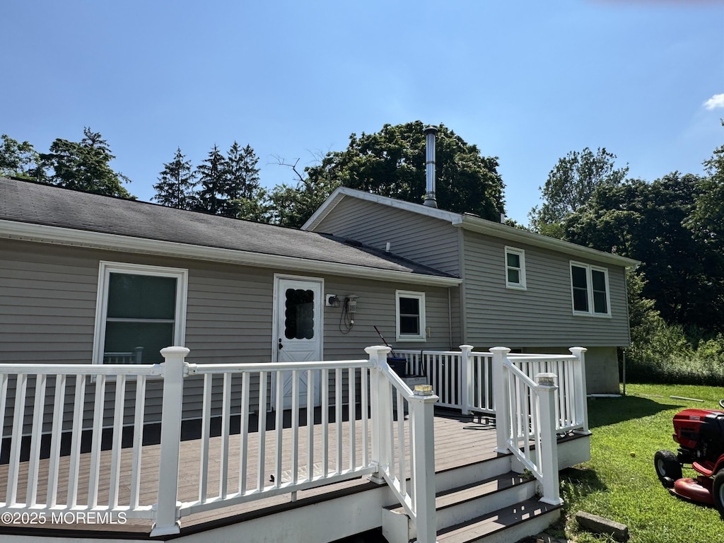 353 Pfister Rd, Jackson, NJ 08527 - back of house featuring a deck and a lawn
