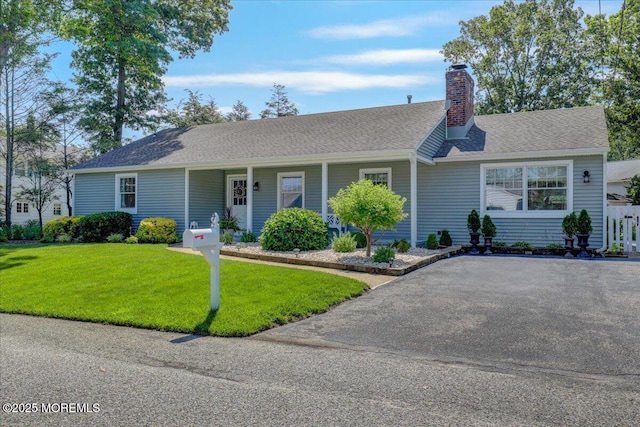 48 Crest Dr, Brick, NJ 08724 - ranch-style home with a front yard, a chimney, and a porch
