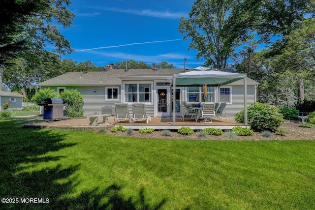 48 Crest Dr, Brick, NJ 08724 - view of front of property featuring a deck, a front lawn, and a chimney