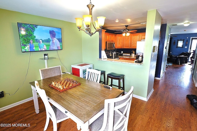 1509 Embury Ave, Neptune Township, NJ 07753 - dining room featuring a chandelier, dark wood-style flooring, and a ceiling fan