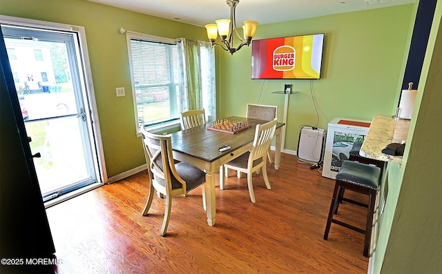 1509 Embury Ave, Neptune Township, NJ 07753 - dining space featuring a chandelier and wood finished floors